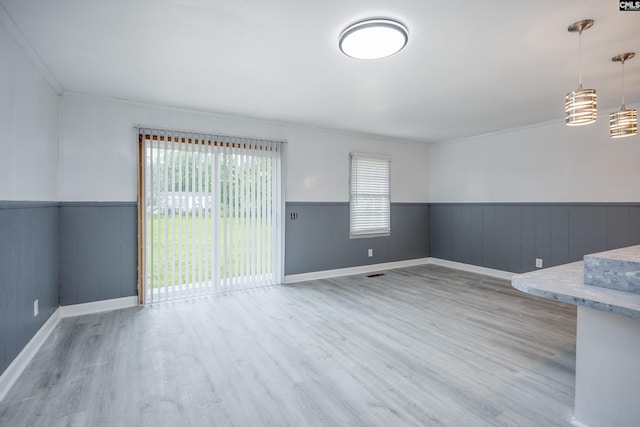 969 Boulevard Rd, Sumter, SC 29153 - empty room with wood finished floors, a wainscoted wall, ornamental molding, and baseboards