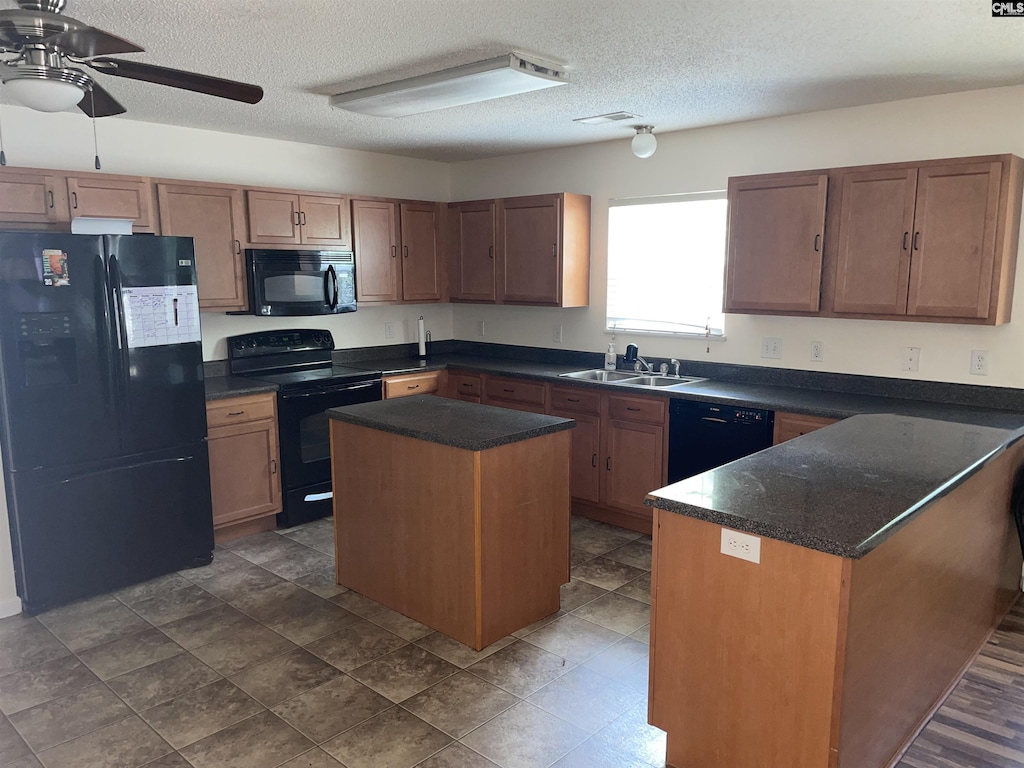 445 Dukes Hill Rd, Columbia, SC 29223 - kitchen featuring black appliances, ceiling fan, a sink, a textured ceiling, and a kitchen island
