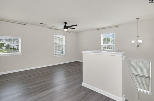 315 Merus Dr, Lexington, SC 29072 - empty room featuring a chandelier, dark wood finished floors, a ceiling fan, and baseboards