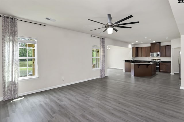 315 Merus Dr, Lexington, SC 29072 - unfurnished living room featuring recessed lighting, dark wood finished floors, plenty of natural light, baseboards, and a ceiling fan
