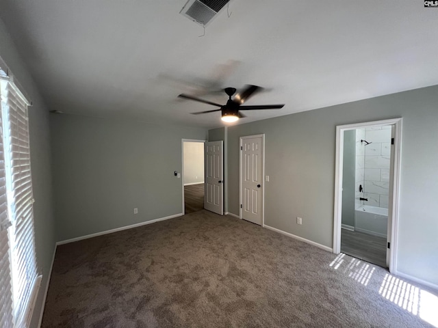 unfurnished bedroom with carpet floors, baseboards, ensuite bathroom, and ceiling fan