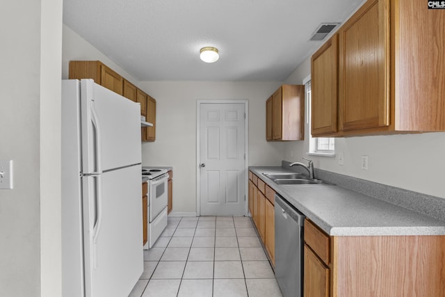127 Curvewood Rd, Columbia, SC 29229 - kitchen with white appliances, a sink, light tile patterned flooring, and brown cabinets