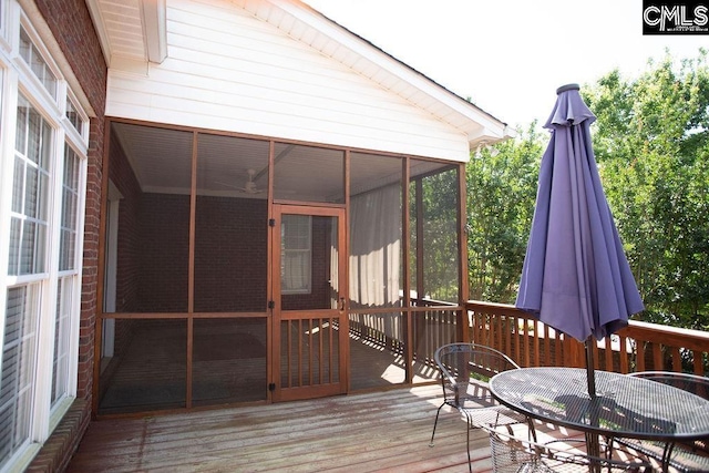 sunroom with outdoor dining space