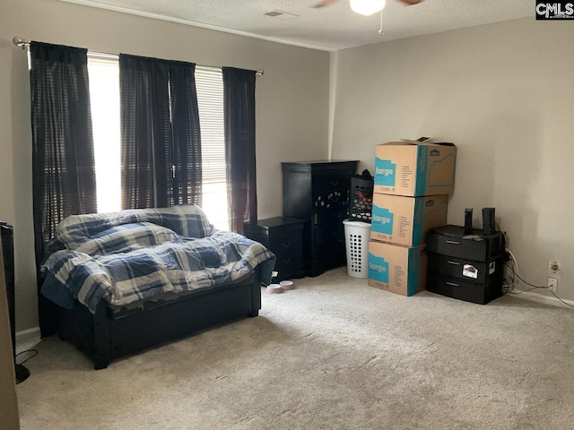 bedroom with carpet and a ceiling fan