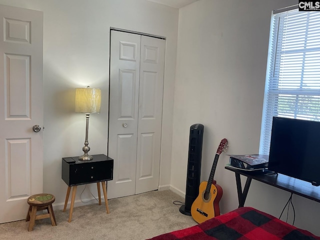 carpeted office space featuring baseboards
