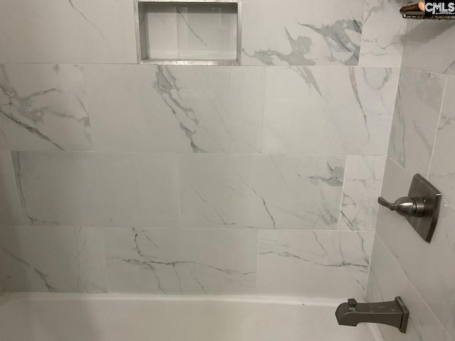 full bath with a shower and a bath