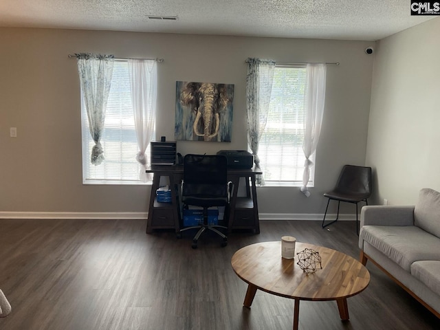 office area featuring wood finished floors, a textured ceiling, and baseboards
