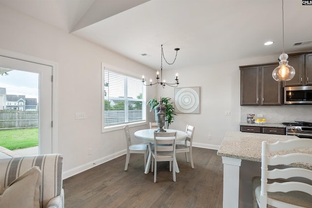 dining room featuring a chandelier, baseboards, dark wood-style floors, and recessed lighting