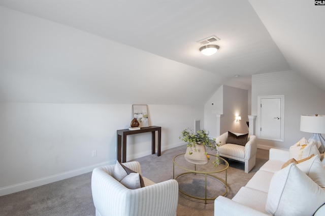 living room with light carpet, vaulted ceiling, and baseboards