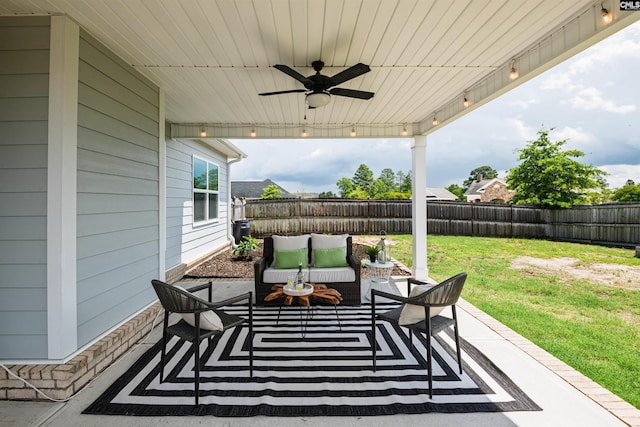 view of patio featuring ceiling fan and an outdoor living space