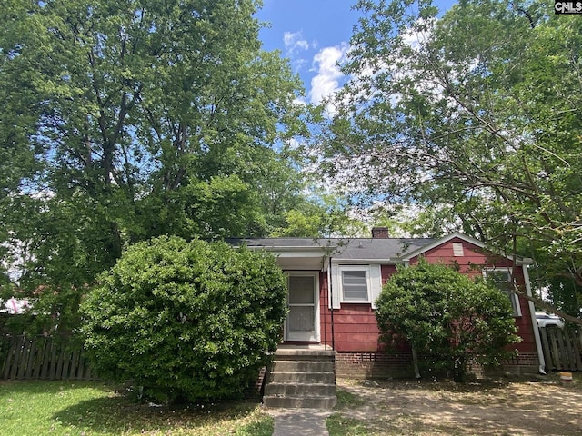 170 Brookland Cir, Columbia, SC 29204 - obstructed view of property featuring fence and a chimney