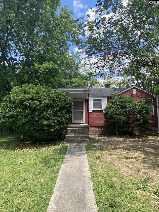 170 Brookland Cir, Columbia, SC 29204 - view of front of house with a chimney and a front yard