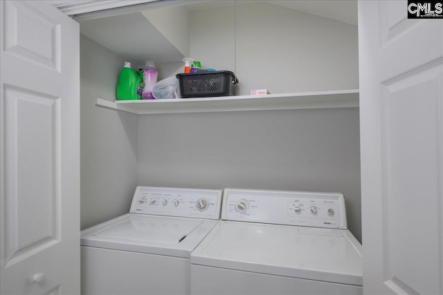 clothes washing area featuring washing machine and dryer