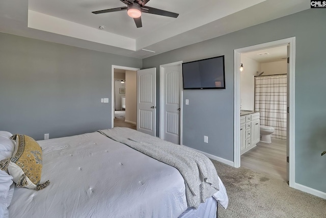 165 Wahoo Cir, Irmo, SC 29063 - bedroom featuring baseboards, light colored carpet, connected bathroom, and ceiling fan