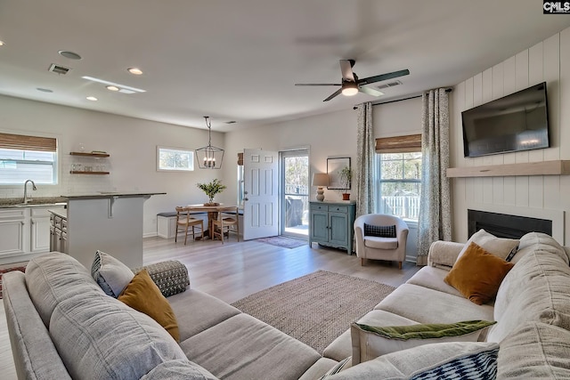 165 Wahoo Cir, Irmo, SC 29063 - living room with healthy amount of natural light, light wood-style floors, ceiling fan, a large fireplace, and recessed lighting