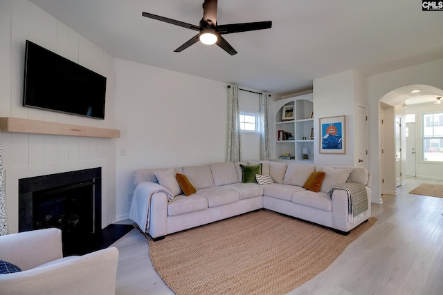 165 Wahoo Cir, Irmo, SC 29063 - living room with arched walkways, light wood-type flooring, plenty of natural light, and a ceiling fan