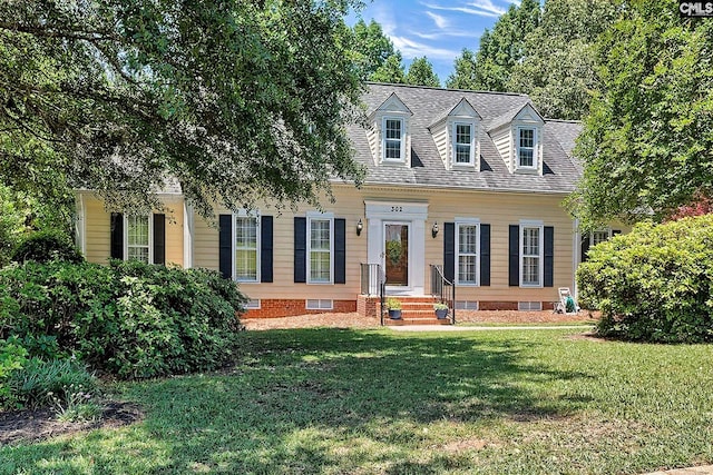 new england style home with a front lawn and crawl space