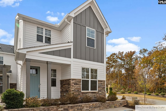 view of front of house with board and batten siding and stone siding