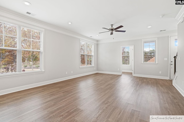 unfurnished living room featuring ceiling fan, wood finished floors, ornamental molding, baseboards, and recessed lighting