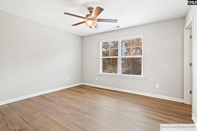 unfurnished room featuring light wood finished floors, ceiling fan, and baseboards