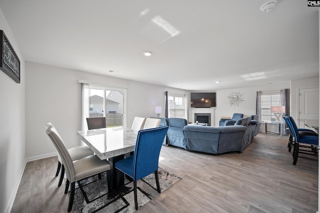 2109 Elmridge Rd, Columbia, SC 29209 - dining area with healthy amount of natural light, light wood-style floors, and a fireplace