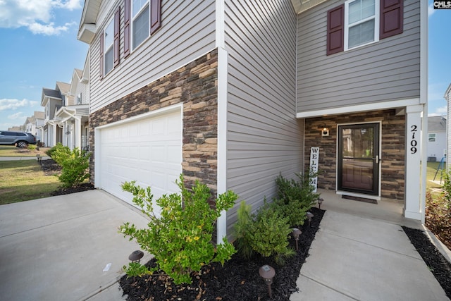 2109 Elmridge Rd, Columbia, SC 29209 - doorway to property featuring stone siding and an attached garage