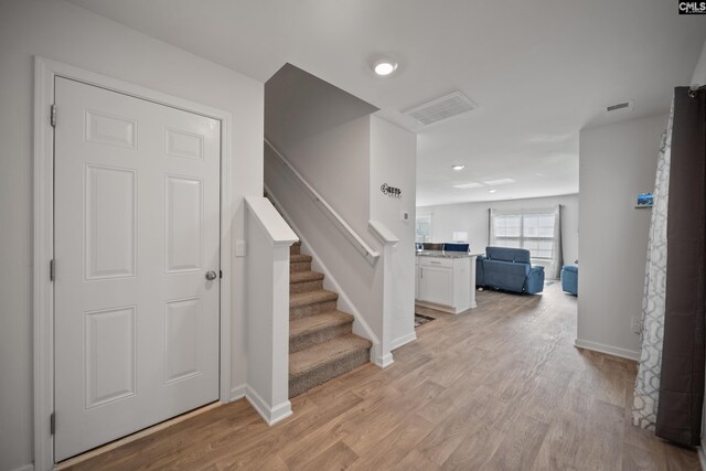 2109 Elmridge Rd, Columbia, SC 29209 - foyer featuring light wood-style flooring, baseboards, and stairs