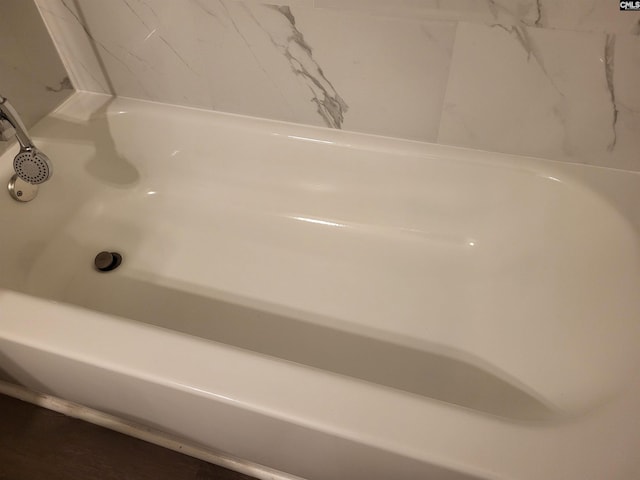 bathroom featuring a tub