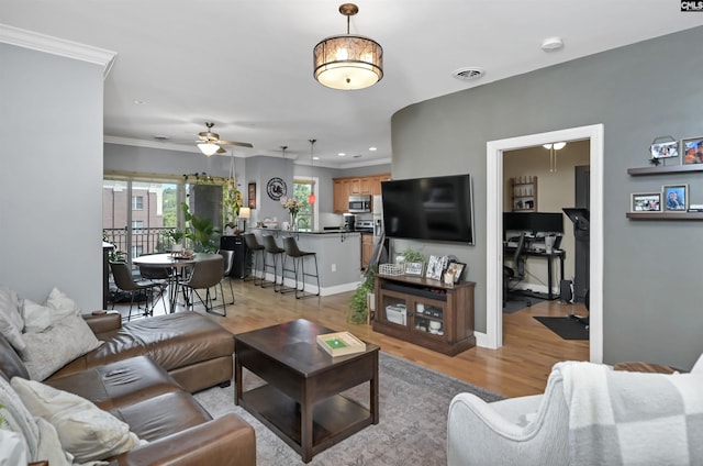 1320 Pulaski St Unit B207, Columbia, SC 29201 - living room featuring light wood-style flooring, a ceiling fan, ornamental molding, baseboards, and recessed lighting