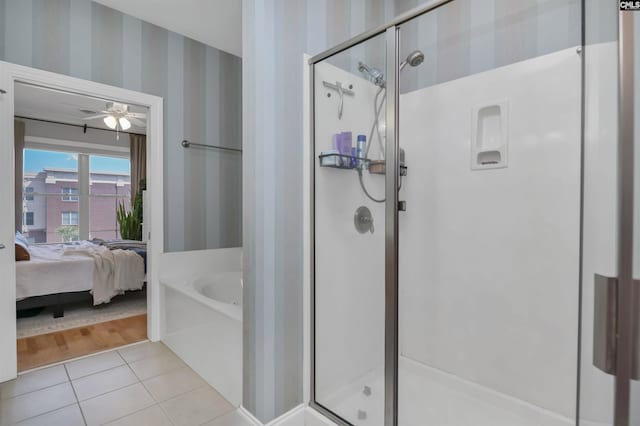 1320 Pulaski St Unit B207, Columbia, SC 29201 - bathroom with wallpapered walls, ensuite bath, a shower stall, tile patterned floors, and a bath