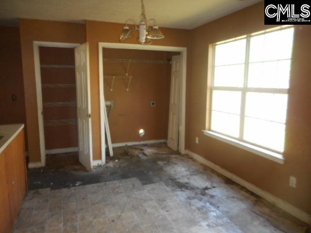 2133 Slighs Ave, Columbia, SC 29204 - unfurnished dining area with a chandelier and baseboards