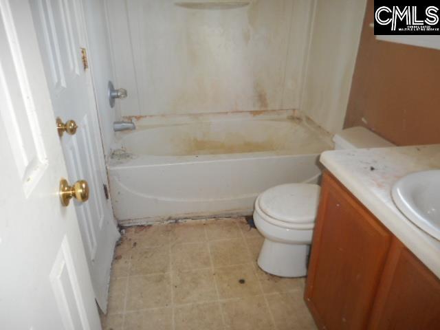 2133 Slighs Ave, Columbia, SC 29204 - full bathroom featuring toilet, vanity, and shower / washtub combination