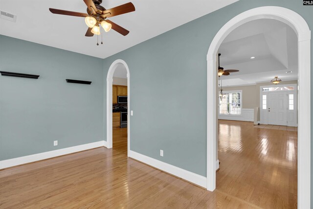 22 Mauser Dr, Lugoff, SC 29078 - unfurnished room with a ceiling fan, a raised ceiling, light wood-style floors, baseboards, and recessed lighting