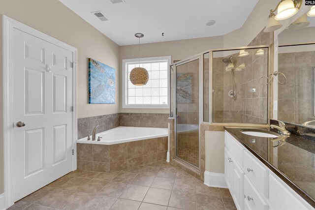 22 Mauser Dr, Lugoff, SC 29078 - bathroom featuring vanity, a shower stall, a garden tub, and tile patterned flooring