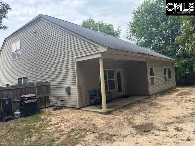 404 Coopers Edge Ln, Blythewood, SC 29016 - view of side of property featuring a patio and fence