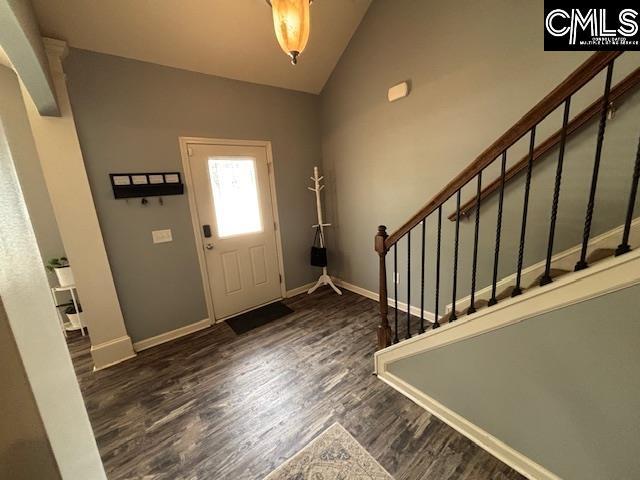 404 Coopers Edge Ln, Blythewood, SC 29016 - foyer entrance with vaulted ceiling, wood finished floors, stairs, and baseboards