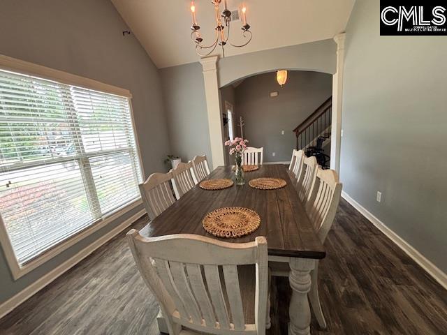 404 Coopers Edge Ln, Blythewood, SC 29016 - dining space with arched walkways, wood finished floors, vaulted ceiling, and baseboards