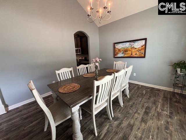 404 Coopers Edge Ln, Blythewood, SC 29016 - dining space with arched walkways, wood finished floors, baseboards, a chandelier, and high vaulted ceiling