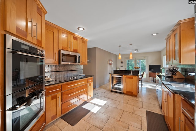 kitchen with beverage cooler, stainless steel appliances, tasteful backsplash, recessed lighting, and stone tile floors