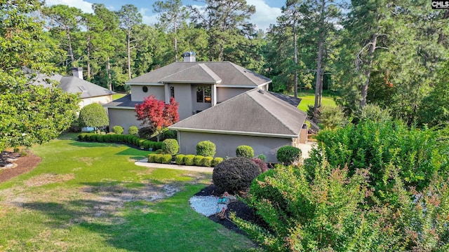 view of front of home featuring a front lawn and stucco siding