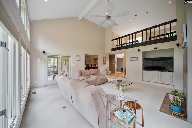 living area with carpet flooring, high vaulted ceiling, beamed ceiling, and a ceiling fan