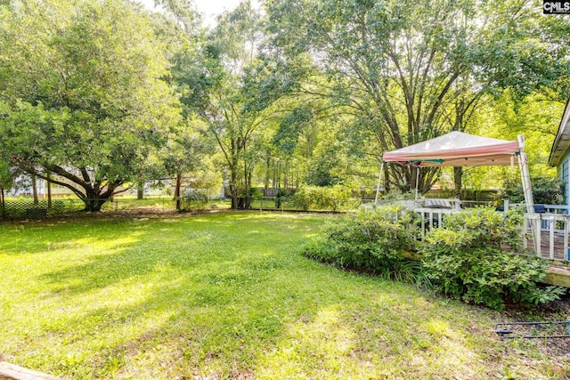 view of yard with a gazebo and a wooden deck
