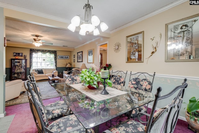 dining area with crown molding, carpet flooring, a chandelier, and ceiling fan