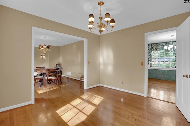 731 Trafalgar Dr, Columbia, SC 29210 - dining space featuring a chandelier, light wood-type flooring, and baseboards