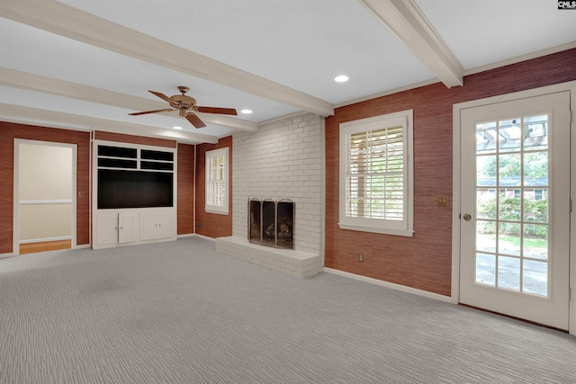 731 Trafalgar Dr, Columbia, SC 29210 - unfurnished living room with beamed ceiling, a brick fireplace, ceiling fan, baseboards, and carpet floors