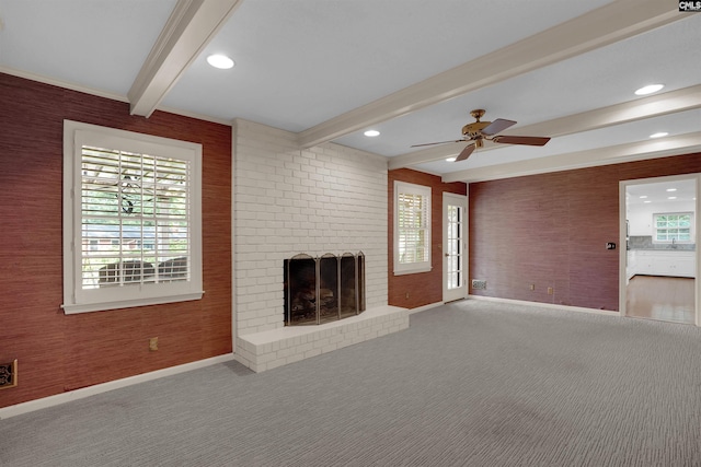 731 Trafalgar Dr, Columbia, SC 29210 - unfurnished living room featuring baseboards, beam ceiling, carpet flooring, a brick fireplace, and a ceiling fan
