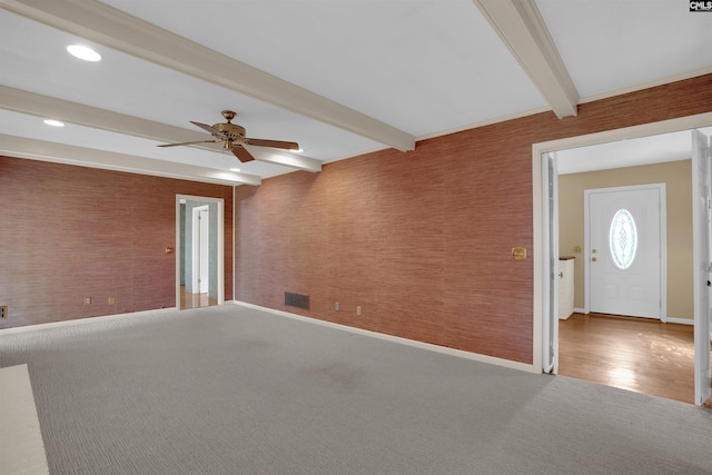 731 Trafalgar Dr, Columbia, SC 29210 - spare room with beamed ceiling, ceiling fan, wallpapered walls, carpet floors, and baseboards