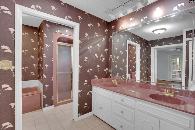 731 Trafalgar Dr, Columbia, SC 29210 - bathroom with tile patterned floors, wallpapered walls, a stall shower, double vanity, and a textured ceiling