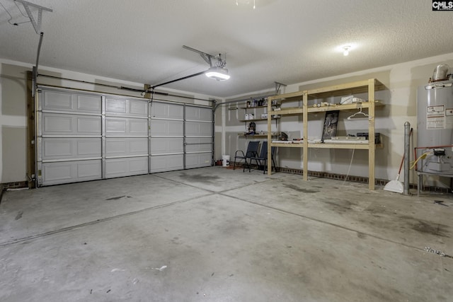 garage featuring water heater and a garage door opener