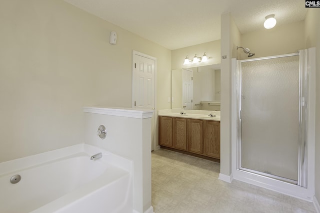 bathroom with a stall shower, a bath, double vanity, tile patterned floors, and baseboards